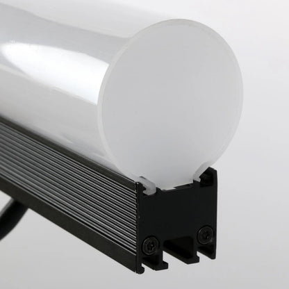 VDO Sceptron 1000mm tube diffuser end detail showing frosted cylindrical lens seated on black finned aluminum fixture body with Torx mounting screws, Martin Lighting