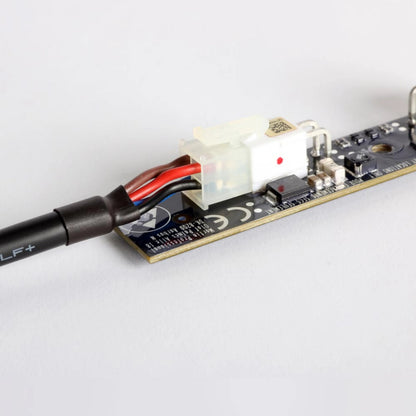 VC-Strip 60 close-up of white power input connector with red and black leads wired to the strip PCB, Martin Lighting