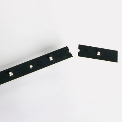 VC-Strip 60 detail of cut-to-length strip end with trimmed segment and notched mounting holes, Martin Lighting