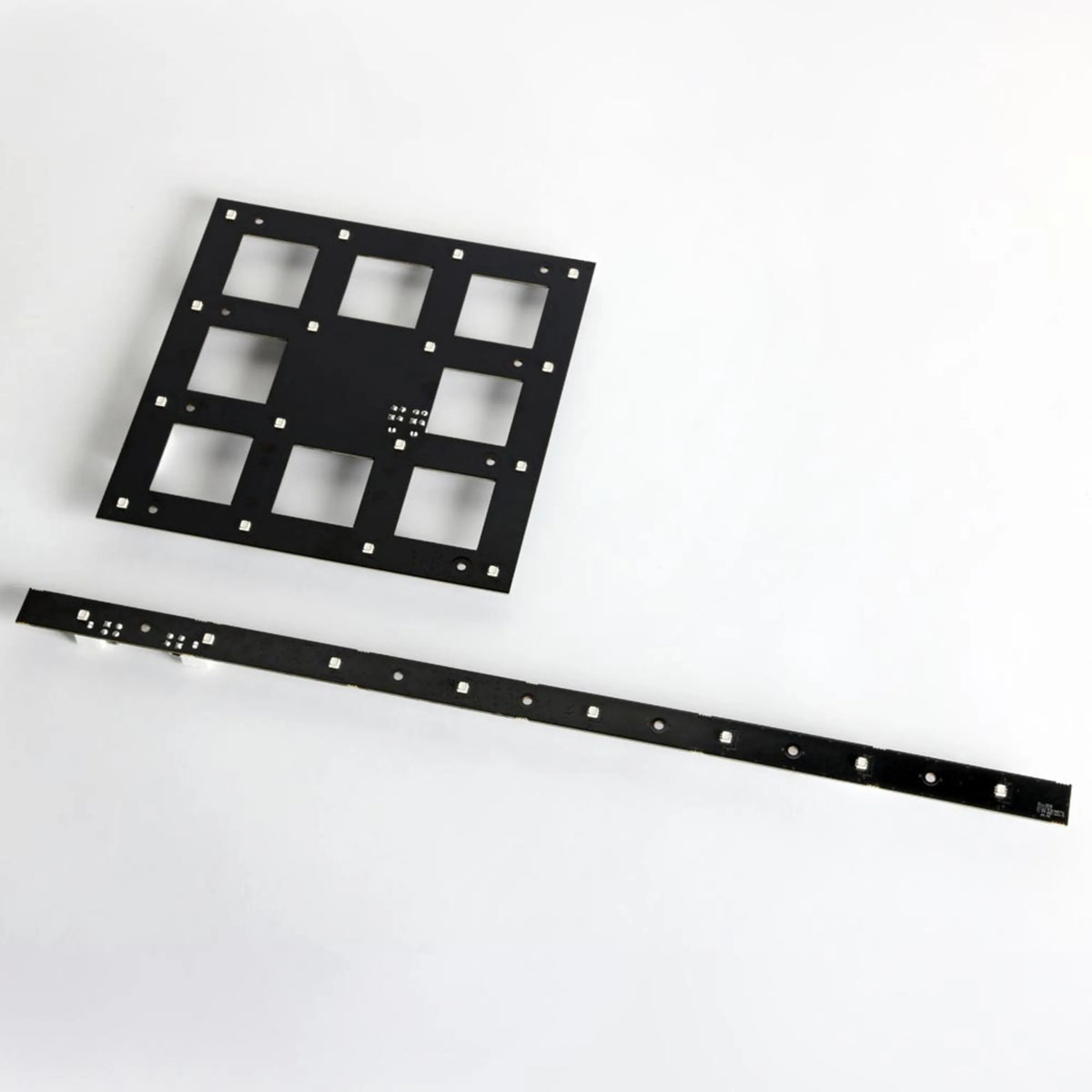 VC-Strip 60 narrow pixel strip paired with a smaller 3x3 LED grid panel on white background, Martin Lighting