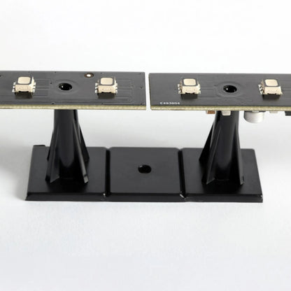 VC-Strip 25 side view of strip mounted on black pedestal standoff base, Martin Lighting