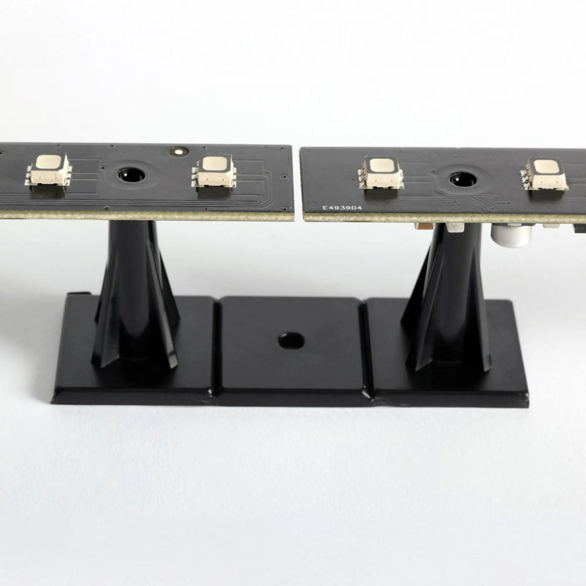 VC-Strip 25 side view mounted on black pedestal standoff bases showing edge profile of the PCB, Martin Lighting