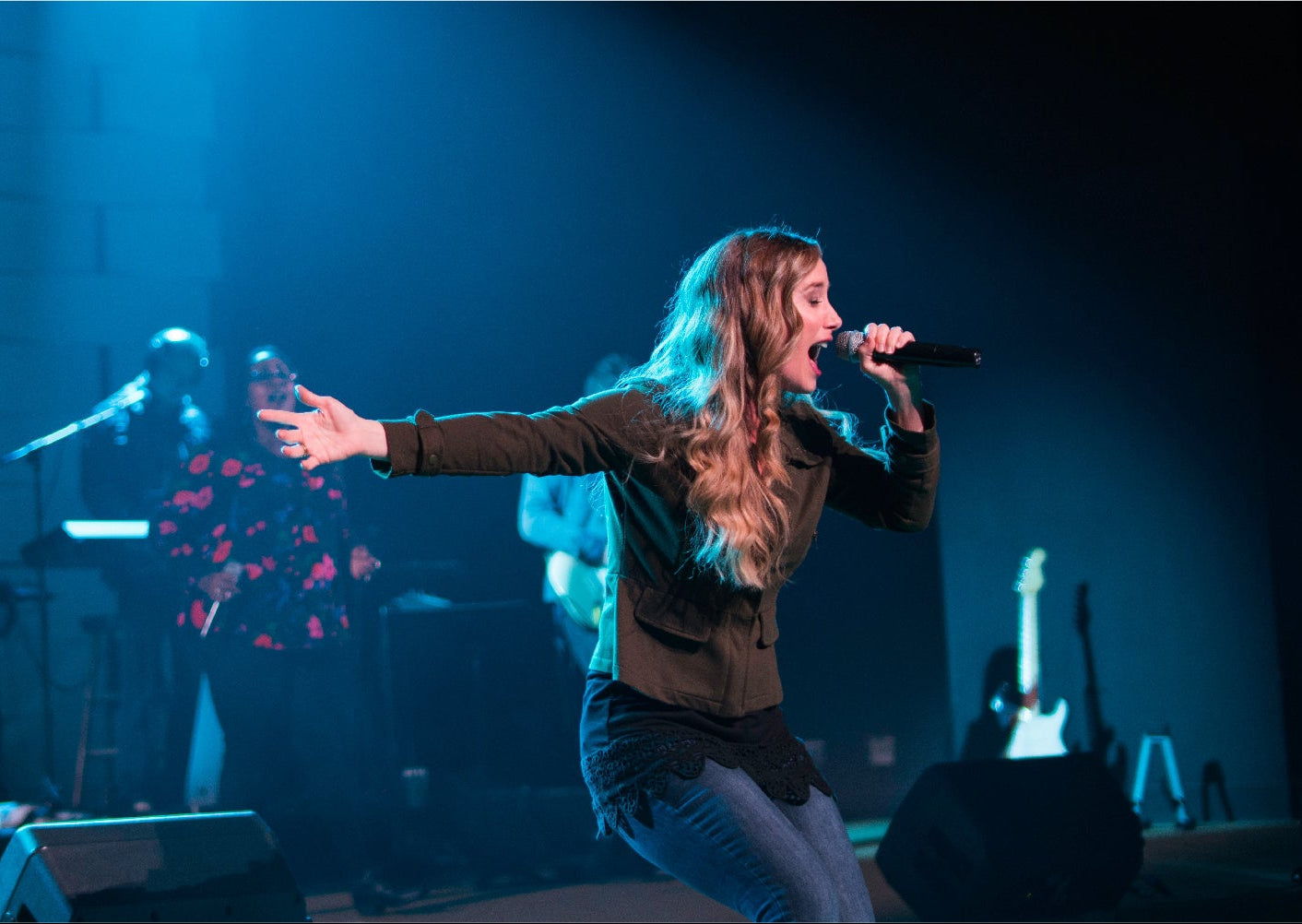church singer on stage using a wireless microphone